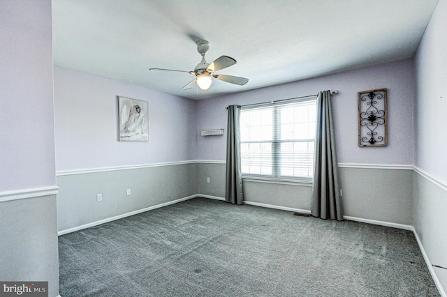 unfurnished room featuring visible vents, baseboards, carpet, and ceiling fan