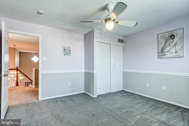 unfurnished bedroom with a closet, visible vents, baseboards, and carpet floors