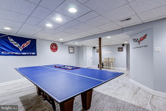 game room with visible vents, wood finished floors, recessed lighting, a paneled ceiling, and baseboards