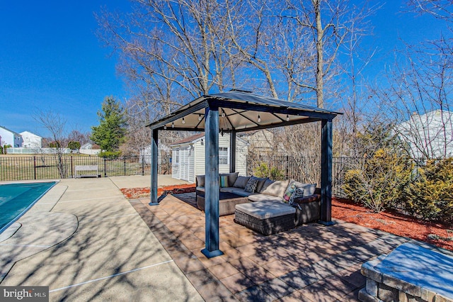 view of patio featuring a gazebo, outdoor lounge area, and fence