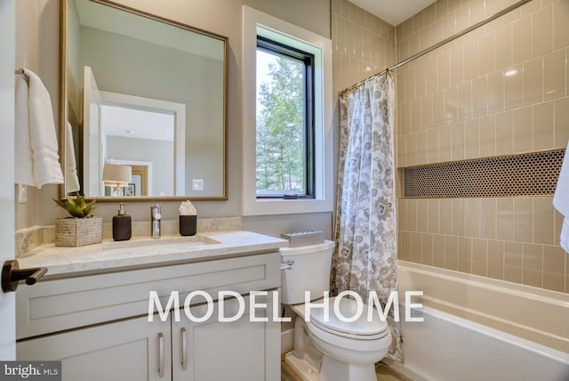 full bathroom featuring toilet, shower / bath combination with curtain, and vanity