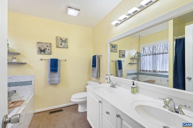 bathroom with a bathtub, hardwood / wood-style floors, toilet, and vanity