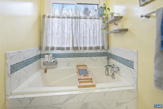 bathroom featuring tiled tub