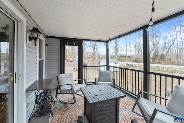 sunroom / solarium with a wealth of natural light