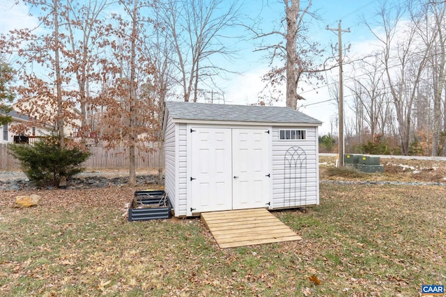 view of outdoor structure with a lawn