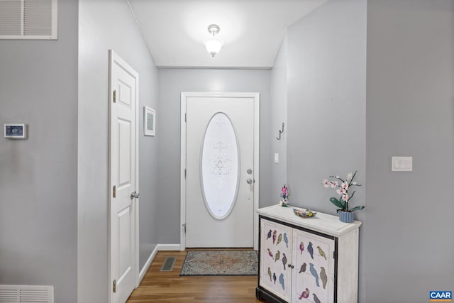 foyer entrance featuring hardwood / wood-style floors