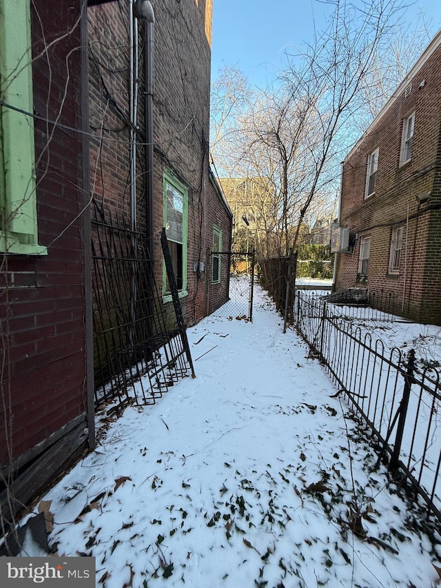 view of yard layered in snow