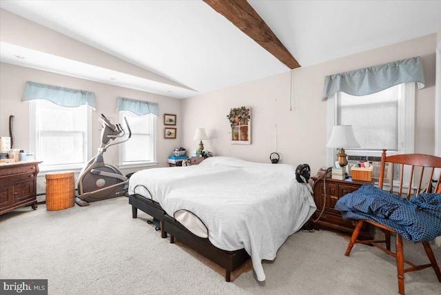 carpeted bedroom featuring lofted ceiling with beams