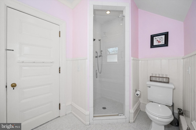 bathroom featuring an enclosed shower and toilet