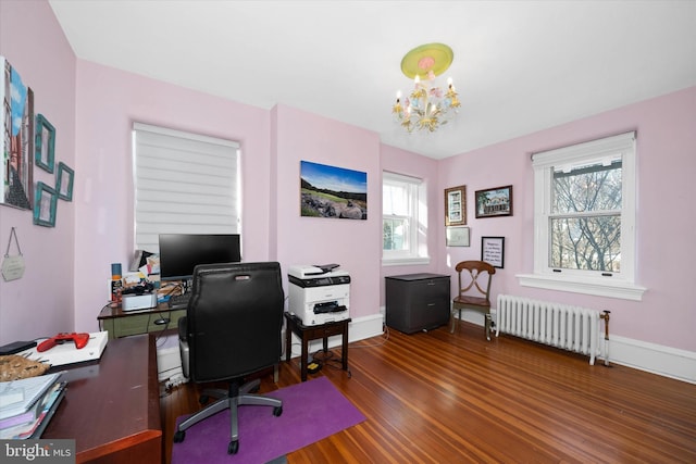 home office featuring radiator, a notable chandelier, plenty of natural light, and dark hardwood / wood-style floors