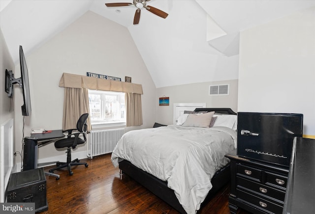 bedroom featuring radiator, dark wood-type flooring, ceiling fan, and vaulted ceiling