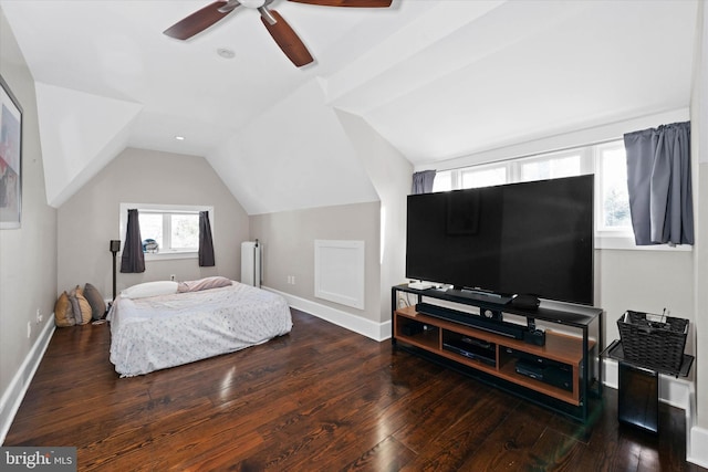 bedroom featuring dark hardwood / wood-style flooring, lofted ceiling, and ceiling fan