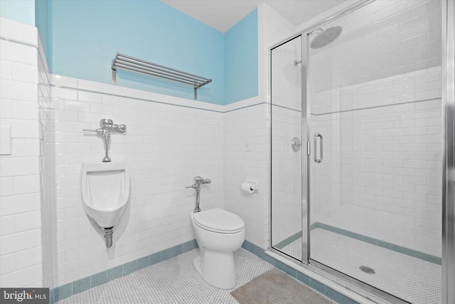 bathroom featuring an enclosed shower, tile patterned flooring, and toilet