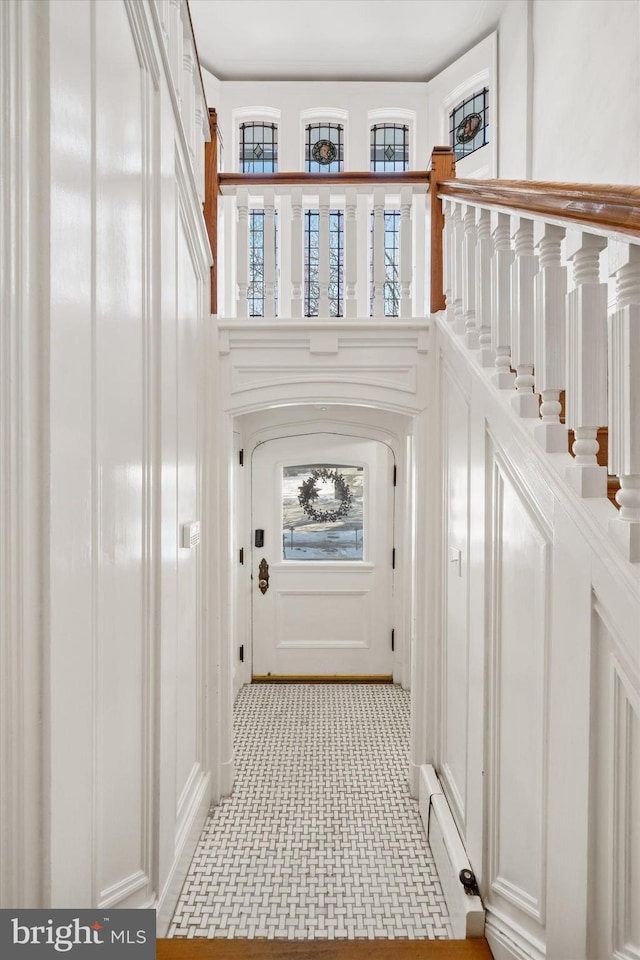 doorway featuring a baseboard heating unit