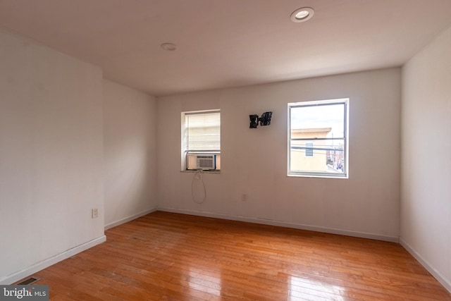 spare room with light wood-type flooring