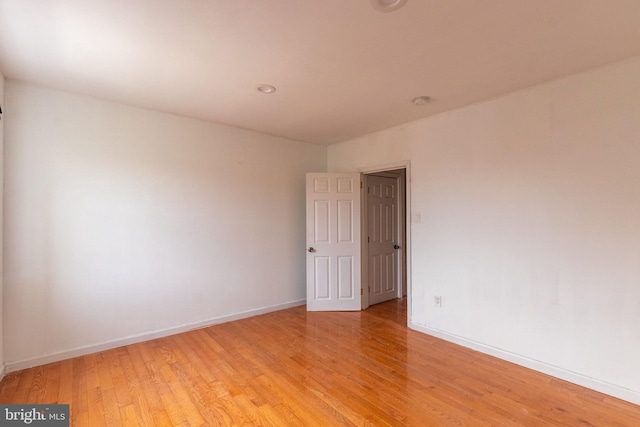 spare room with light hardwood / wood-style floors