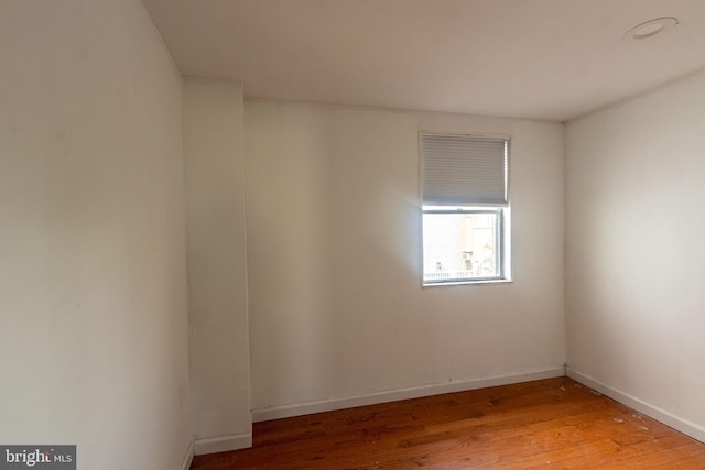 unfurnished room featuring hardwood / wood-style floors