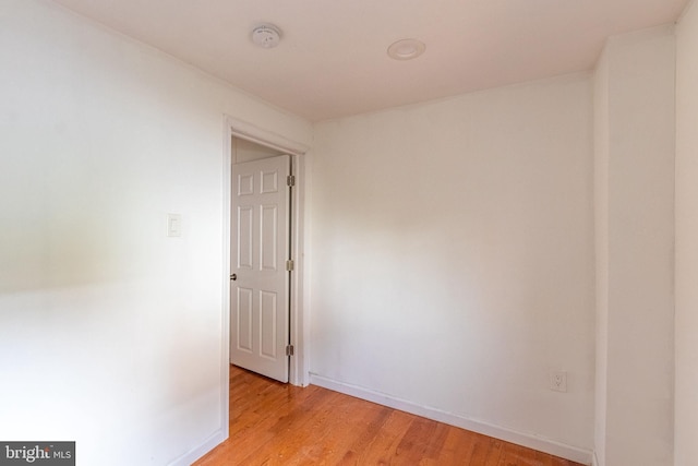 spare room featuring light wood-type flooring