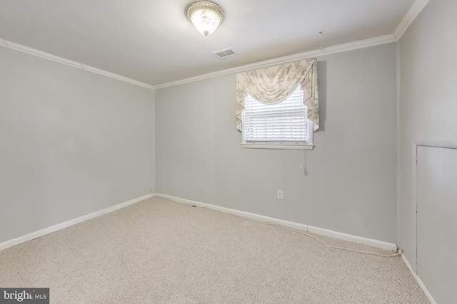 spare room featuring crown molding and carpet flooring