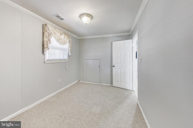 carpeted empty room with crown molding