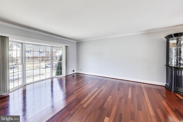 unfurnished living room featuring dark wood-type flooring and ornamental molding