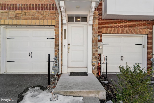 view of exterior entry featuring a garage