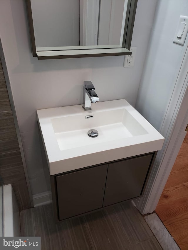 bathroom featuring vanity and wood-type flooring