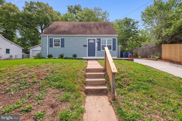 view of front of home with a garage and a front yard