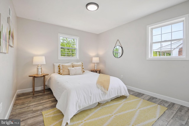 bedroom with hardwood / wood-style floors