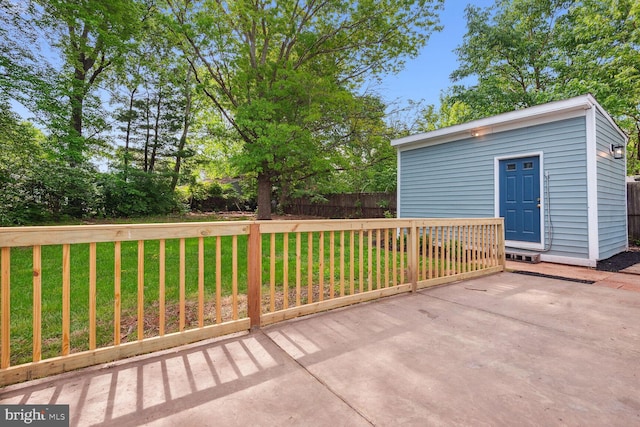 view of patio / terrace with an outbuilding