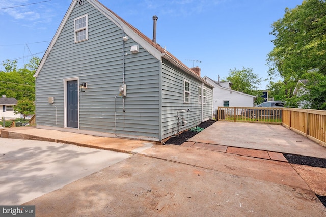 rear view of property featuring a patio