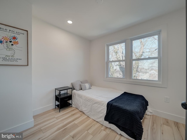 bedroom with light hardwood / wood-style floors