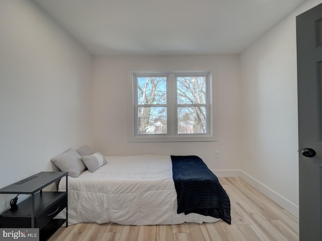 bedroom with light wood-type flooring