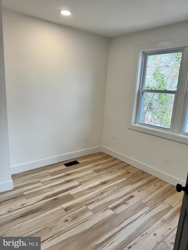 empty room featuring light hardwood / wood-style floors