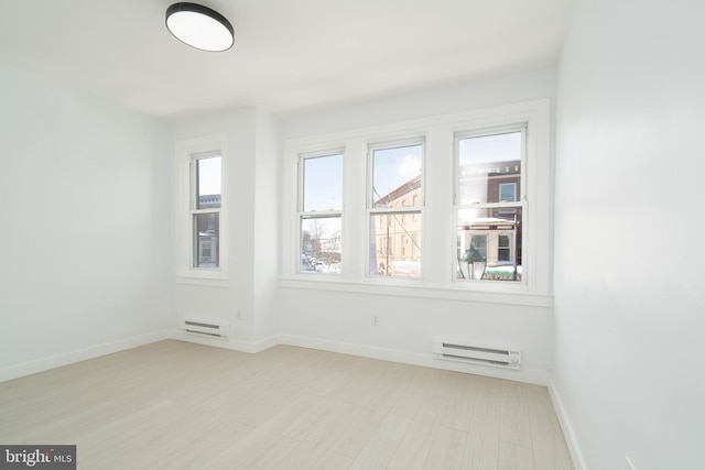 empty room featuring baseboard heating