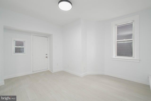 spare room with light wood-type flooring