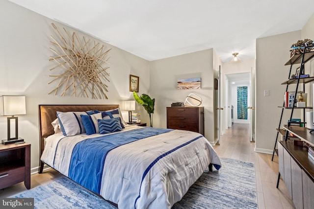 bedroom with light wood-type flooring