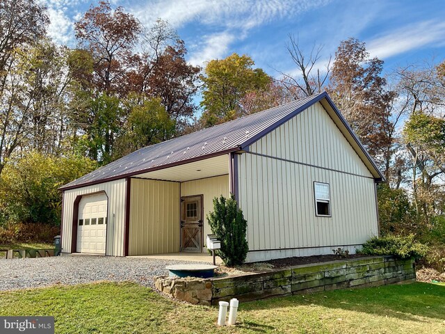 exterior space featuring an outbuilding and a garage