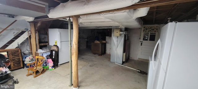 basement with white fridge