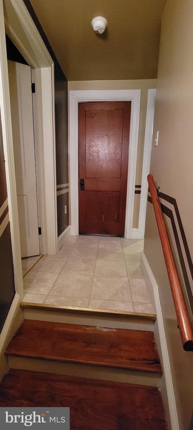 hallway featuring light tile patterned flooring