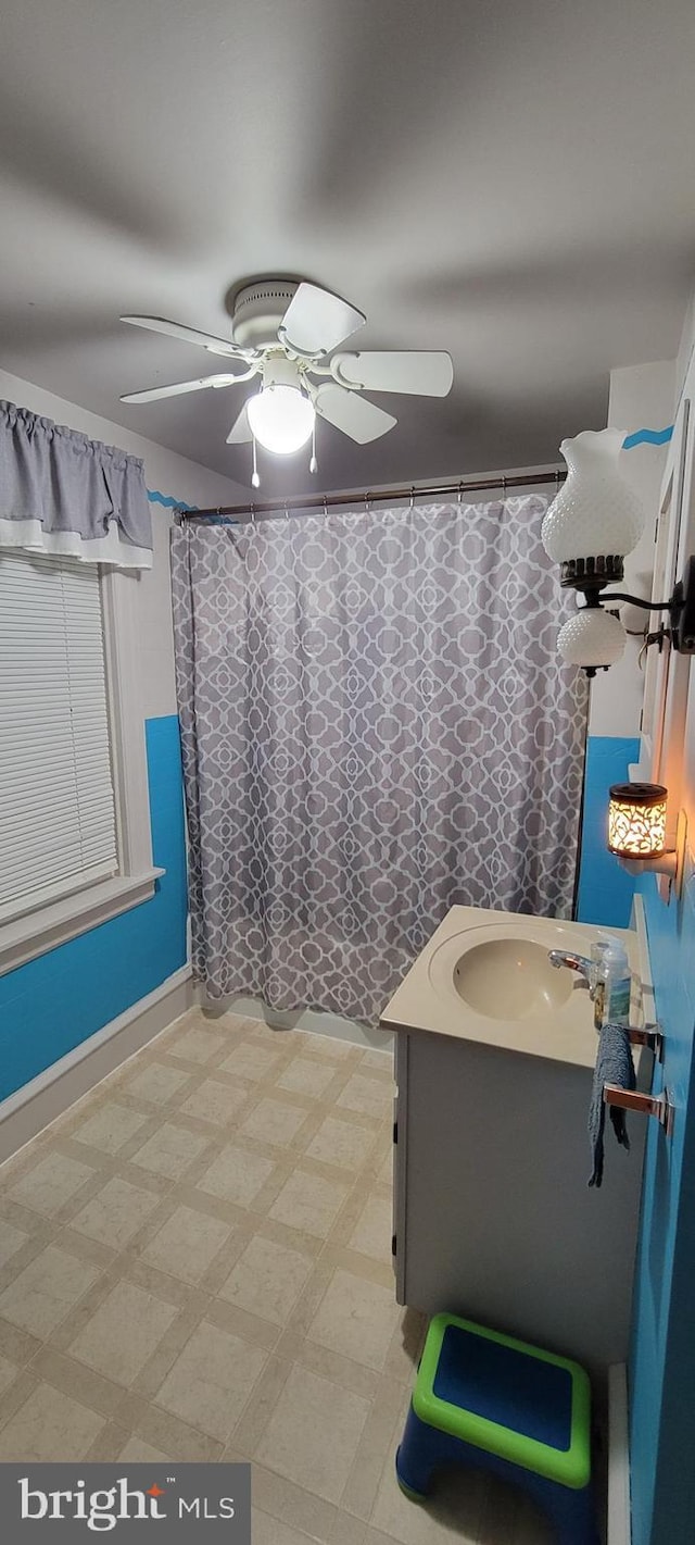 bathroom featuring vanity and ceiling fan