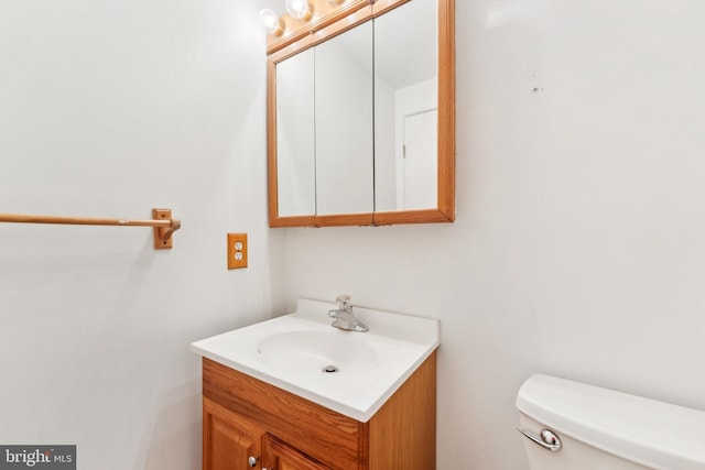 bathroom with toilet and vanity