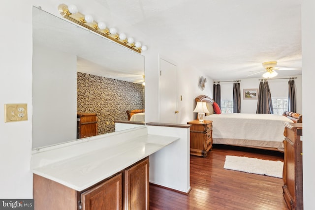 bedroom featuring ceiling fan and dark hardwood / wood-style flooring