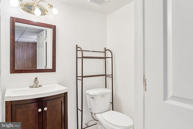 bathroom with toilet and vanity