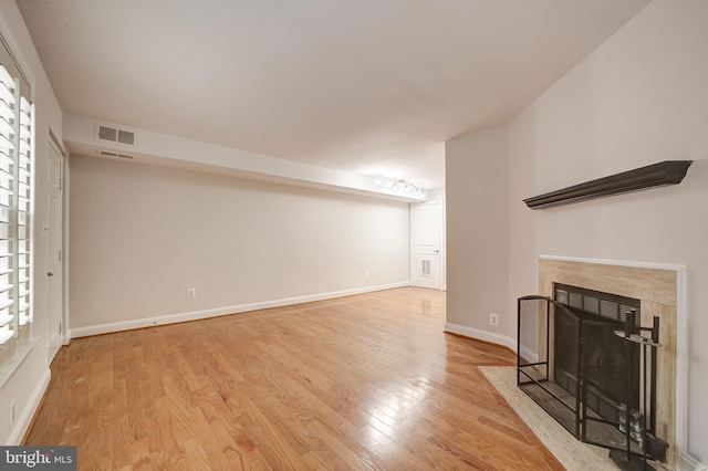 unfurnished living room with light wood-type flooring