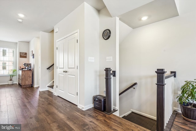 corridor with dark hardwood / wood-style floors