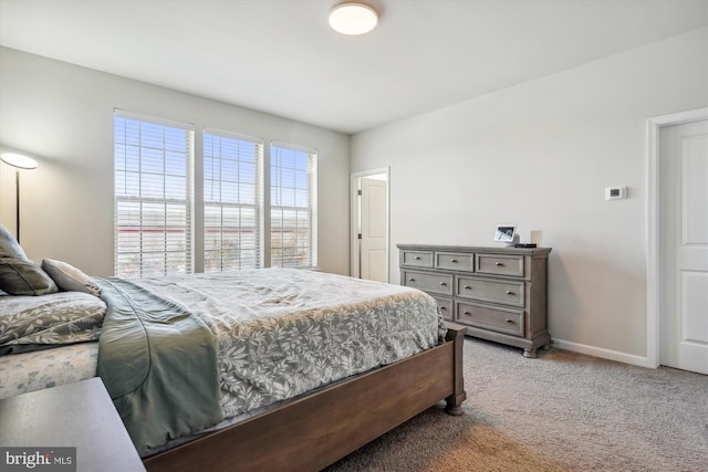 bedroom with light colored carpet