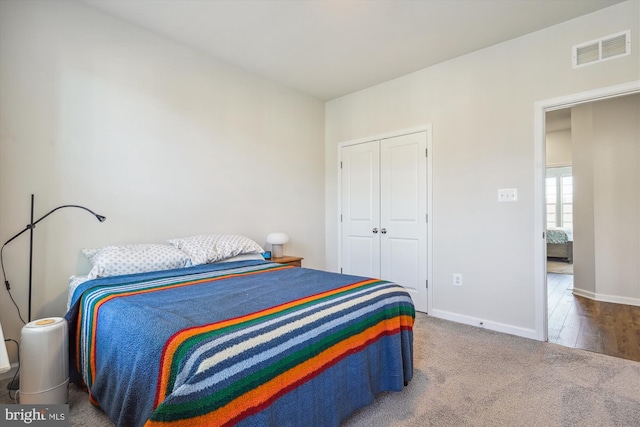 bedroom with carpet floors and a closet