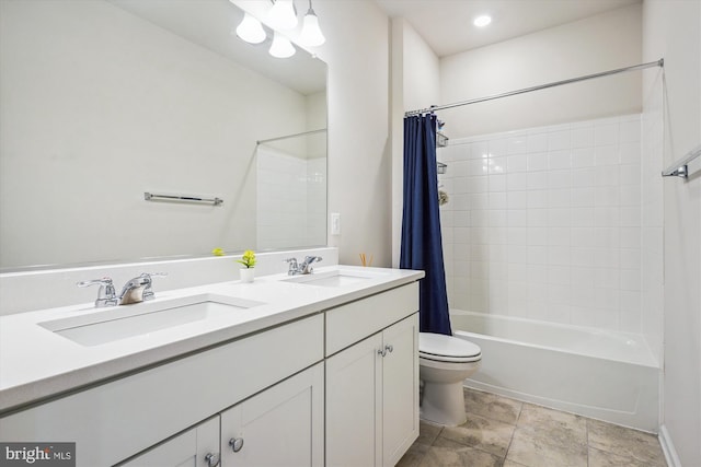 full bathroom featuring vanity, shower / tub combo with curtain, and toilet