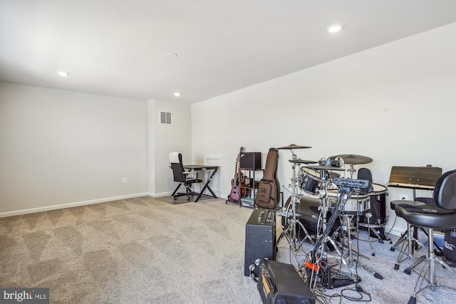 miscellaneous room with light colored carpet